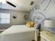 Charming bedroom with dandelion wall art and ceiling fan at 1323 Hammock Shade Dr, Lakeland, FL 33809