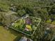 Aerial view of a home with a large backyard and detached shed at 1323 Hammock Shade Dr, Lakeland, FL 33809