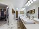 Bathroom with dual vanities and marble flooring at 1323 Hammock Shade Dr, Lakeland, FL 33809