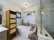 Relaxing bathroom featuring a freestanding tub and marble tile at 1323 Hammock Shade Dr, Lakeland, FL 33809
