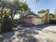 Single-story home with garage and landscaped yard at 1323 Hammock Shade Dr, Lakeland, FL 33809