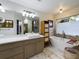 Spa-like bathroom with soaking tub, walk-in shower, and dual vanity at 1323 Hammock Shade Dr, Lakeland, FL 33809