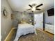 Serene bedroom with dandelion wall art and ceiling fan at 1323 Hammock Shade Dr, Lakeland, FL 33809