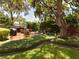 Relaxing patio with seating area, grill, and lush landscaping at 1323 Hammock Shade Dr, Lakeland, FL 33809