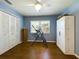 Spacious bedroom with hardwood floors, large closet, and neutral walls at 1323 Hammock Shade Dr, Lakeland, FL 33809