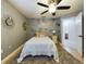 Inviting bedroom with dandelion wall art and ceiling fan at 1323 Hammock Shade Dr, Lakeland, FL 33809