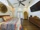 Spacious bedroom with hardwood floors, large windows and a ceiling fan at 1323 Hammock Shade Dr, Lakeland, FL 33809