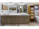 Bathroom with dual vanities and marble flooring at 1323 Hammock Shade Dr, Lakeland, FL 33809