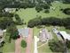 Aerial view showing two houses with lush green surroundings and brick driveways at 659 Howard Ave, Lakeland, FL 33815