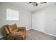 Relaxing bedroom with a comfortable recliner and built-in closet at 11 Loma Verde # 11, Lakeland, FL 33813