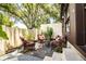 Private patio with seating area and lush greenery at 11 Loma Verde # 11, Lakeland, FL 33813