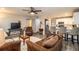Open concept living room and kitchen with modern appliances and flooring at 11 Loma Verde # 11, Lakeland, FL 33813
