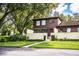 Two-story townhome with a charming front yard and walkway at 11 Loma Verde # 11, Lakeland, FL 33813