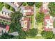 Aerial view of a community with red tile roofs and lush landscaping at 11 Loma Verde # 11, Lakeland, FL 33813