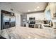 Modern kitchen with white cabinets, stainless steel appliances, and granite counters at 11 Loma Verde # 11, Lakeland, FL 33813