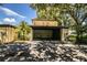 Covered carport with access to the front door and a welcoming sign at 11 Loma Verde # 11, Lakeland, FL 33813