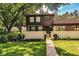 Two-story townhome with a charming front yard and walkway at 11 Loma Verde # 11, Lakeland, FL 33813