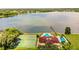 Community clubhouse with pool, tennis courts, and lake access at 11 Loma Verde # 11, Lakeland, FL 33813