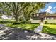 Two-story townhome with a charming front yard and walkway at 11 Loma Verde # 11, Lakeland, FL 33813