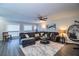 Relaxing living room with sectional sofa, egg chair and hardwood floors at 11 Loma Verde # 11, Lakeland, FL 33813