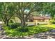 Two-story townhome nestled amongst mature trees at 11 Loma Verde # 11, Lakeland, FL 33813