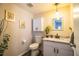 Clean bathroom with marble countertop, white vanity and toilet at 11 Loma Verde # 11, Lakeland, FL 33813