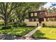 Two-story townhome nestled amongst lush trees at 11 Loma Verde # 11, Lakeland, FL 33813