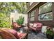 Relaxing patio with wicker furniture and colorful plants at 11 Loma Verde # 11, Lakeland, FL 33813