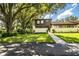 Two-story townhome with a charming front yard and walkway at 11 Loma Verde # 11, Lakeland, FL 33813