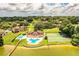 Community pool and tennis courts near the lake at 11 Loma Verde # 11, Lakeland, FL 33813