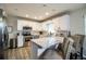 Modern kitchen with white cabinets, stainless steel appliances, and granite countertops at 11 Loma Verde # 11, Lakeland, FL 33813