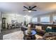Living room with sectional sofa, large windows and ceiling fan at 11 Loma Verde # 11, Lakeland, FL 33813
