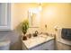 Updated bathroom with marble countertop and white vanity at 11 Loma Verde # 11, Lakeland, FL 33813