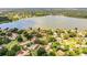 Aerial view showing a lakefront property in a quiet community at 11 Loma Verde # 11, Lakeland, FL 33813