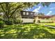 Two-story townhome with a charming front yard and walkway at 11 Loma Verde # 11, Lakeland, FL 33813