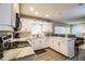 Modern kitchen with white cabinets, stainless steel appliances, and granite counters at 11 Loma Verde # 11, Lakeland, FL 33813
