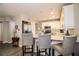 Kitchen features breakfast bar with seating and stainless steel appliances at 11 Loma Verde # 11, Lakeland, FL 33813