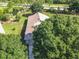 Aerial view showcasing home's roofline and yard at 665 Lake Clark Pl, Lakeland, FL 33813