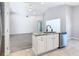 Kitchen island with granite countertop and stainless steel dishwasher at 665 Lake Clark Pl, Lakeland, FL 33813