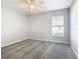 Bright bedroom with ceiling fan and carpet at 665 Lake Clark Pl, Lakeland, FL 33813