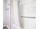 Bathroom with a tub, shower, and grab bars at 665 Lake Clark Pl, Lakeland, FL 33813