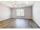 Spacious bedroom with ceiling fan and vinyl flooring at 665 Lake Clark Pl, Lakeland, FL 33813