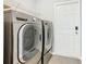 Laundry room with LG washer and dryer, and shelving at 665 Lake Clark Pl, Lakeland, FL 33813
