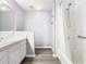 Clean bathroom with a large vanity, tub and shower at 665 Lake Clark Pl, Lakeland, FL 33813