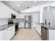 Modern kitchen with stainless steel appliances and granite countertops at 665 Lake Clark Pl, Lakeland, FL 33813
