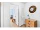 A hallway with light walls, built-in closet, and access to a bedroom at 1920 E Edgewood Dr # G5, Lakeland, FL 33803