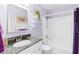 A clean bathroom with granite countertop, white tub, and shower at 1920 E Edgewood Dr # G5, Lakeland, FL 33803