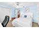 Bedroom with a white bed frame, built-in shelving and closet at 1920 E Edgewood Dr # G5, Lakeland, FL 33803