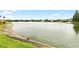 Serene lakefront view with lush green grass at 1920 E Edgewood Dr # G5, Lakeland, FL 33803