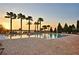 Community pool with palm trees and sunset view at 4538 Grandview Glen Dr, Auburndale, FL 33823